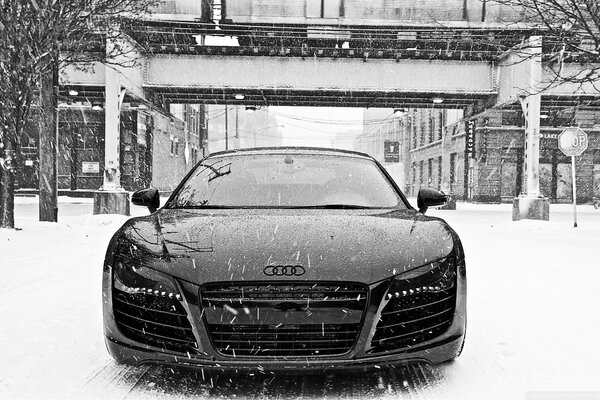 Audi on a snowy road b/w