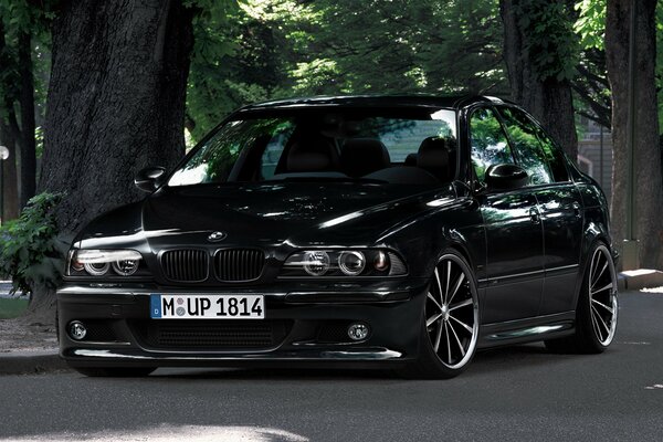 Black bmw with beautiful headlights and wheels