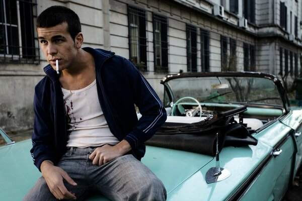 Actor Mario Casas sits and smokes in the car