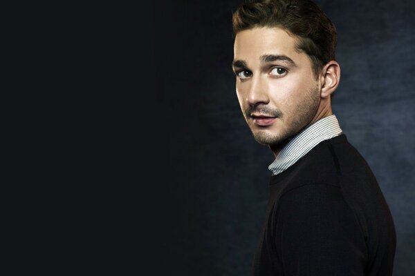 Image of a male actor on a dark background