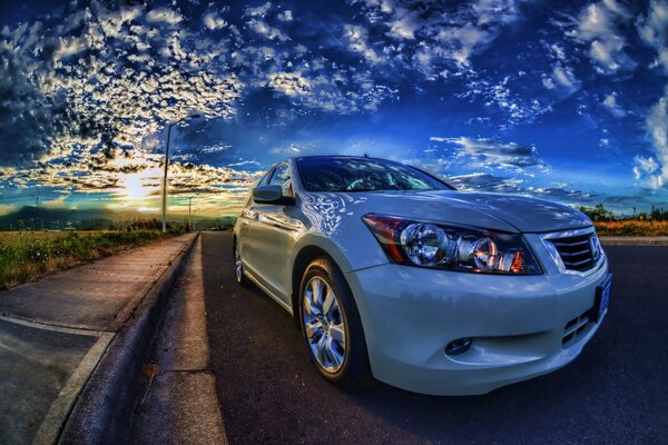 White skoda chords on a beautiful sky background