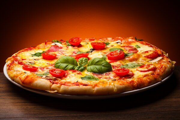 Pizza with tomatoes and basil