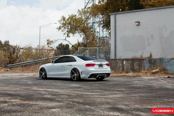 White Audi with tinted windows