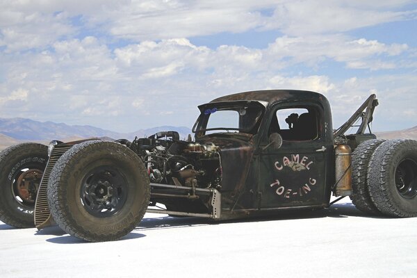 Racing retro car on a salt lake