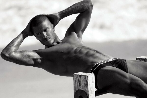 Black and white photo of a muscular David Beckham