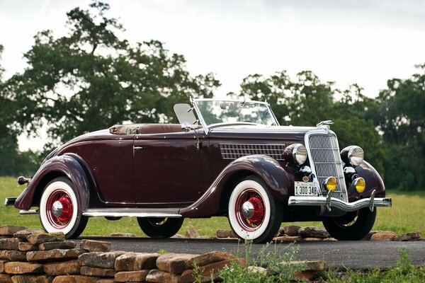 A 1935 Ford Roadster v8 car on the road