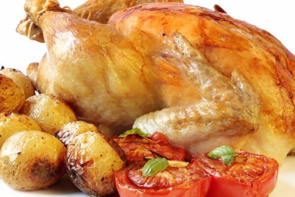 Delicious chicken baked with potatoes and tomatoes