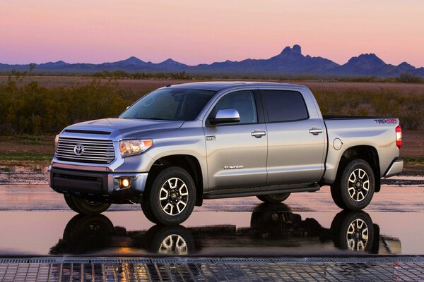 Presentation of the car on the background of a beautiful evening sunset