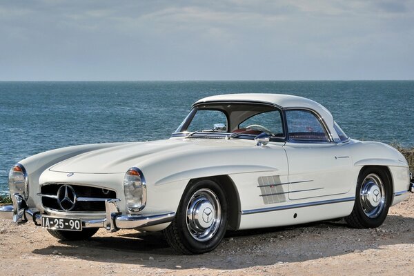 Vintage Mercedes on the background of the raging sea