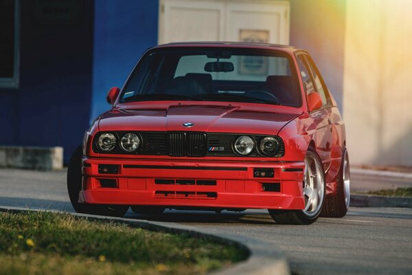 Red BMW on low-profile rubber