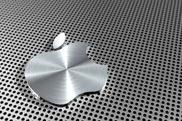 Unusual metal apple logo on a holey background