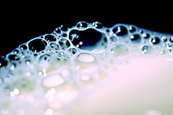 Bubbles of milk foam in a glass