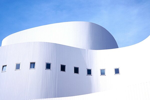 A snow-white building with graceful curves