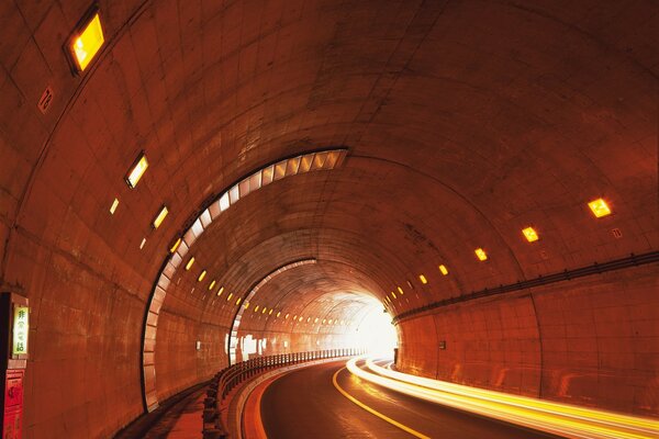 Glowing tunnel lights and road