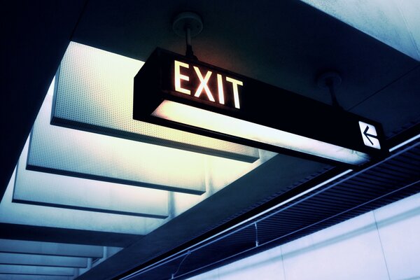 The sign exit to the subway is suspended