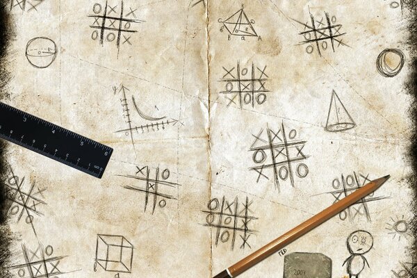 Papier avec une image du jeu TIC-tac-Toe, il y a un crayon, une règle et une râpe