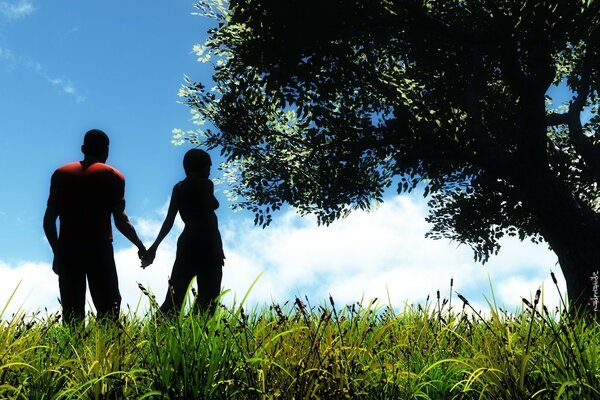 Silhouettes of a couple in love in nature by a tree