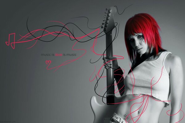 A red-haired girl with a guitar in her mouth