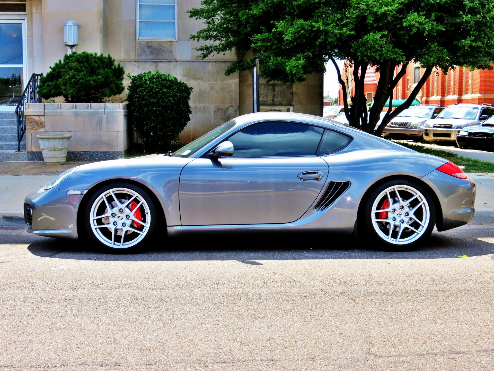 auto porsche cayman sportwagen silber tuning felgen straße parkplatz