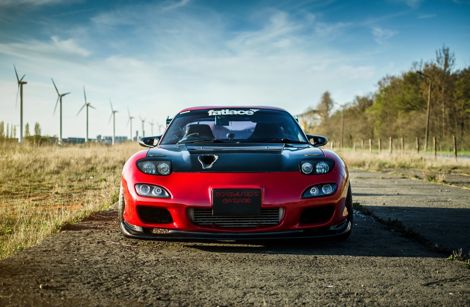 mazda rx-7 red mazda red front sky clouds wind turbine