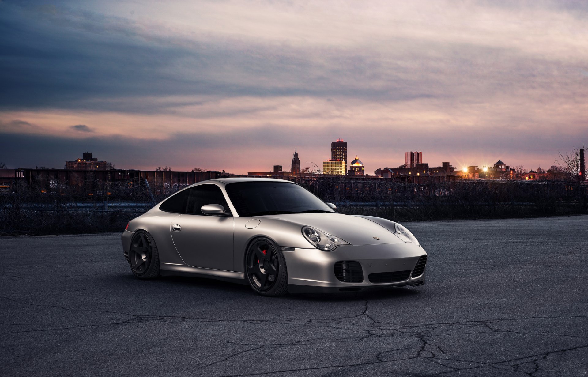 porsche 911 silvery front sunset town horizon