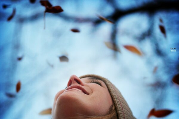 A girl with love in her eyes looks at the sky