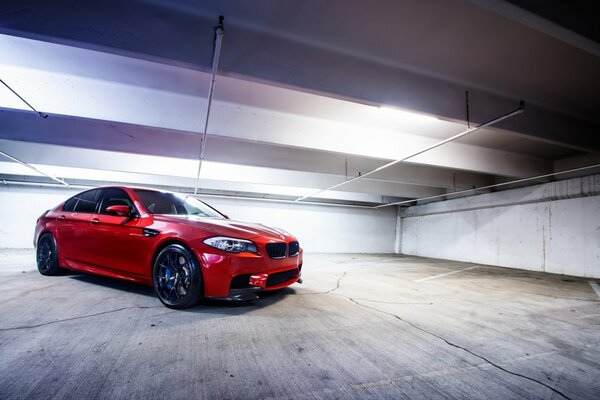 Powerful red car in the hangar