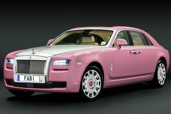 Pink elegant Rolls Royce on a dark background