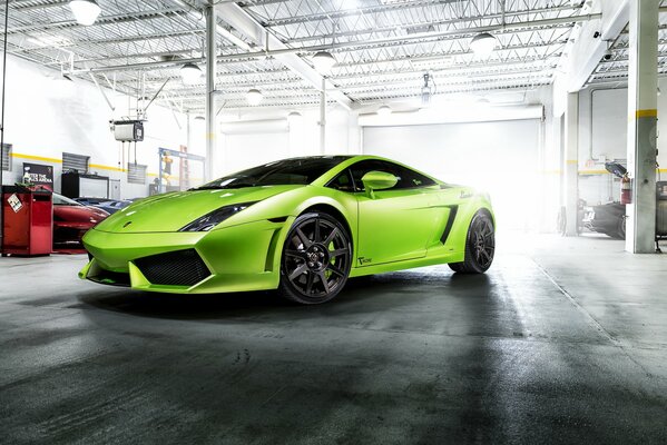 A green car in a white room