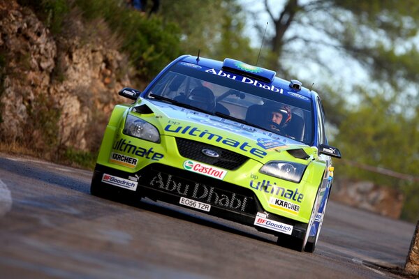 Racing cars on the race track in motion