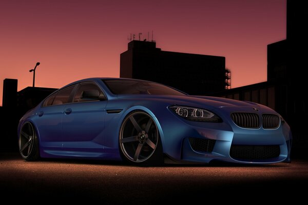 Stylish blue BMW in the evening city