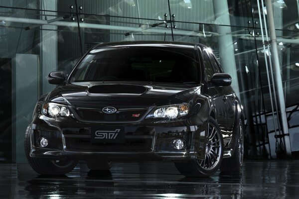 Voiture noire Subaru Impreza. Rehaut