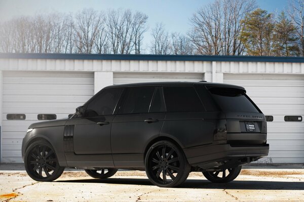 Black matte profile of the range Rover with black discs