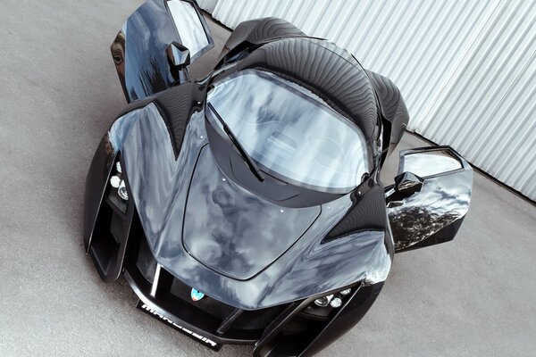 Black supercar with open doors