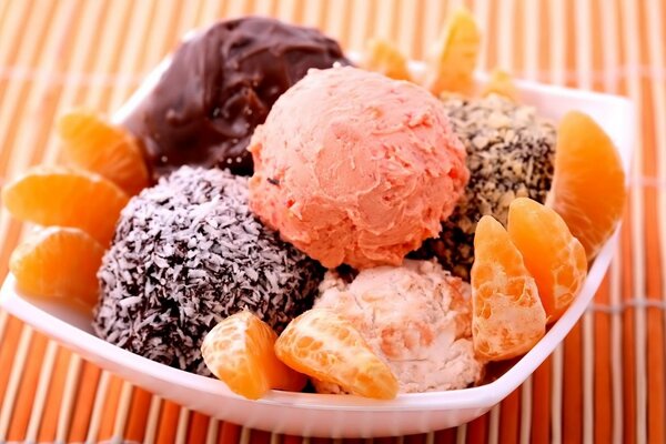 Assorted ice cream with tangerines, beautiful serving