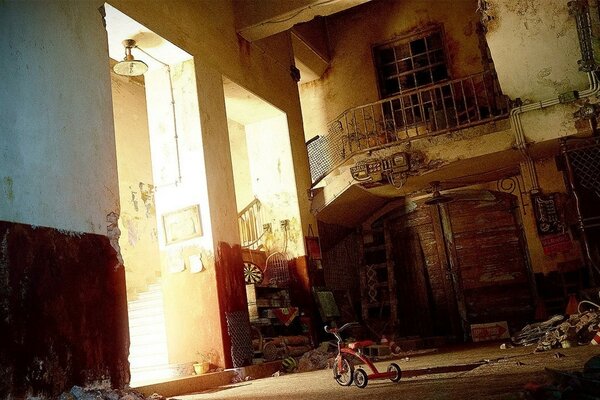 Bike in the yard with trash and stairs