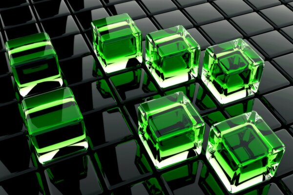 Cubes verts en verre sur des carrés noirs