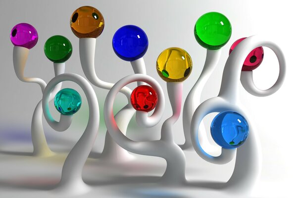 Boules de verre multicolores, sur des supports blancs