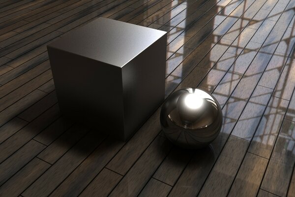 The cube and the ball stand on the parquet