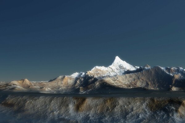 Les montagnes enneigées se reflètent dans l eau