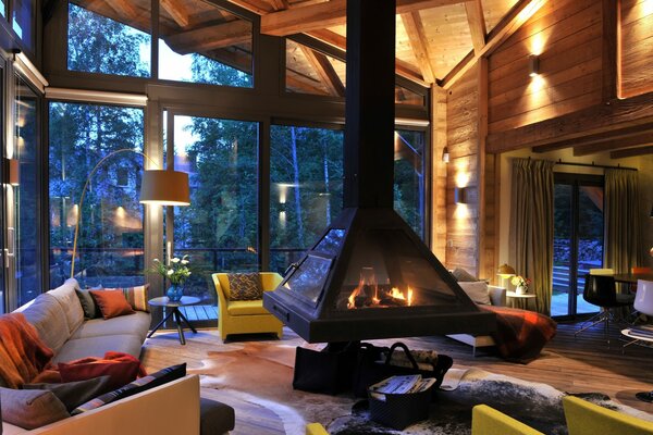 Beautiful interior of the room with large windows and fireplace