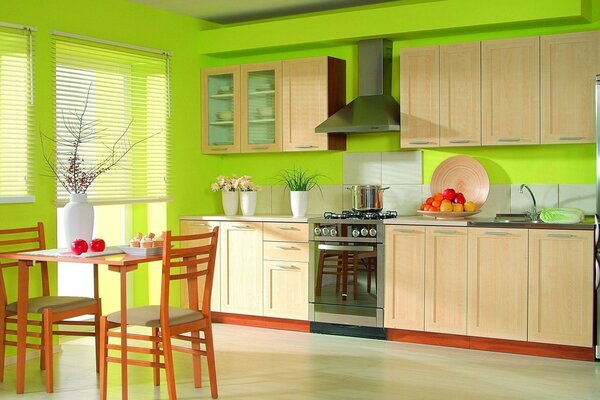 Green kitchen with comfortable furniture