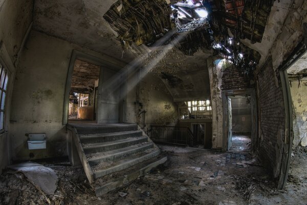 An abandoned building with ruined steps