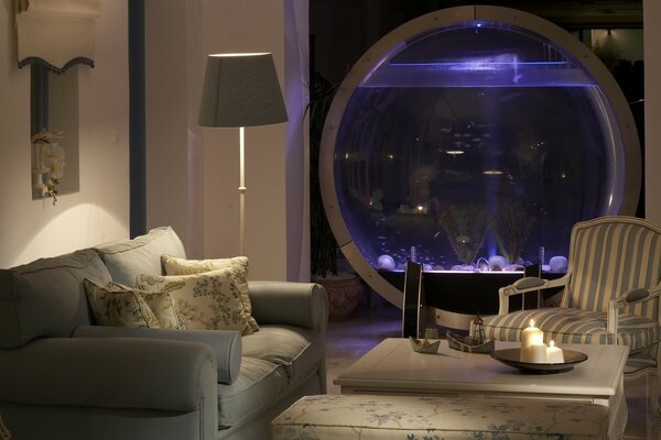 Large round aquarium in the room