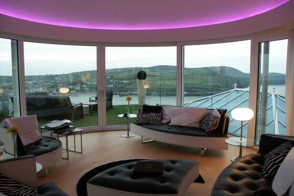 Living room on the background of panoramic windows