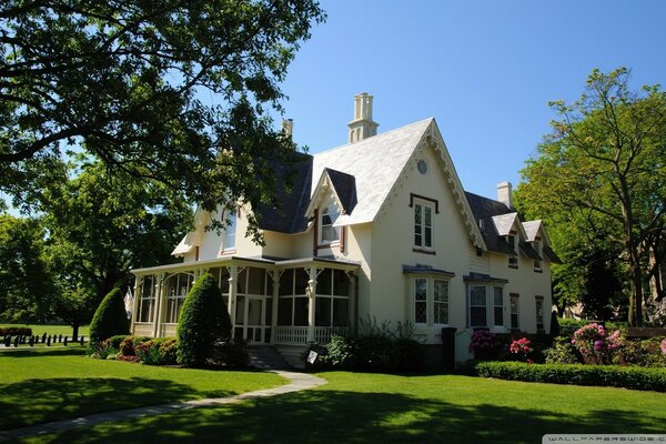 Private white house with lawn