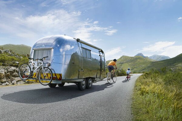 Cyclists and the metal house on the tracks