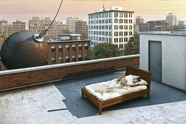 In the morning, the man on the bed was on the roof of a high-rise building