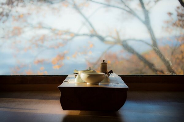 Table on the background of an autumn landscape