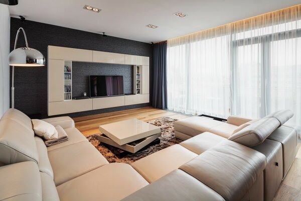 Bright living room with sofa and TV